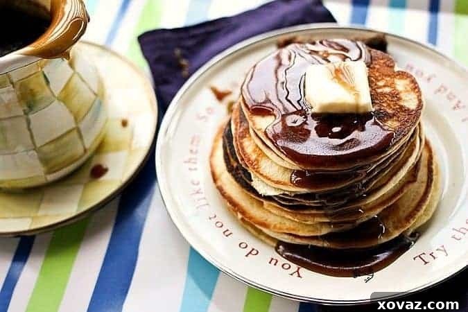 Homemade buttermilk pancakes with rich brown sugar butter pancake and waffle syrup on top.