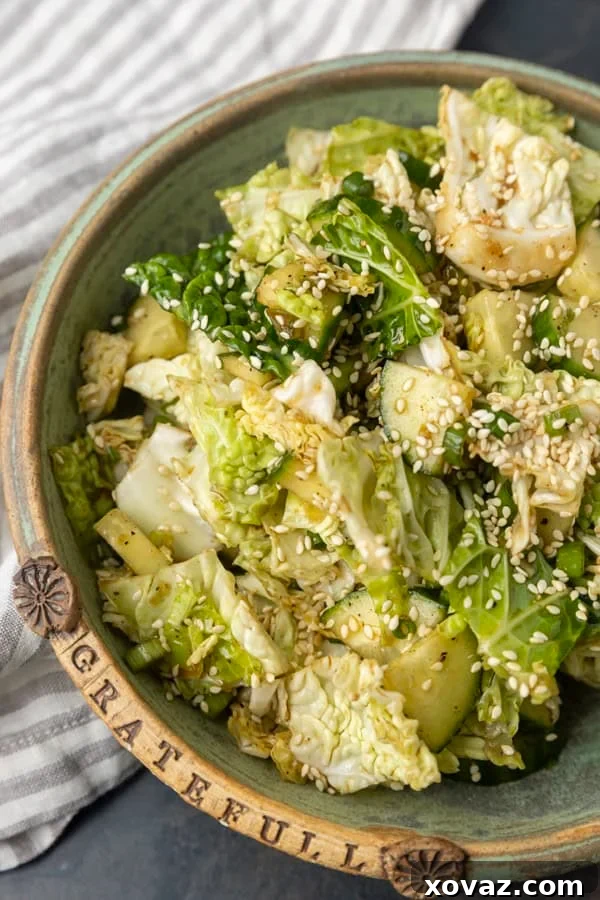 close-up of Japanese cabbage and cucumber salad in a white bowl, showing fresh ingredients