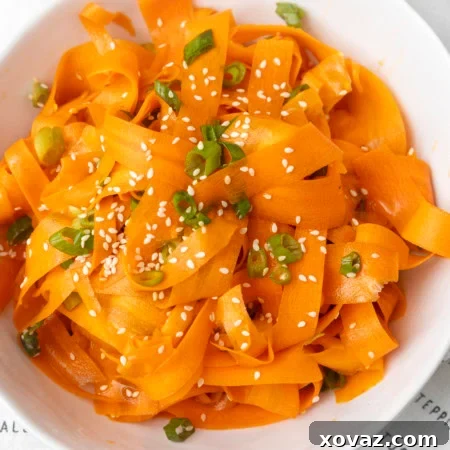 carrot ribbon salad in a white bowl