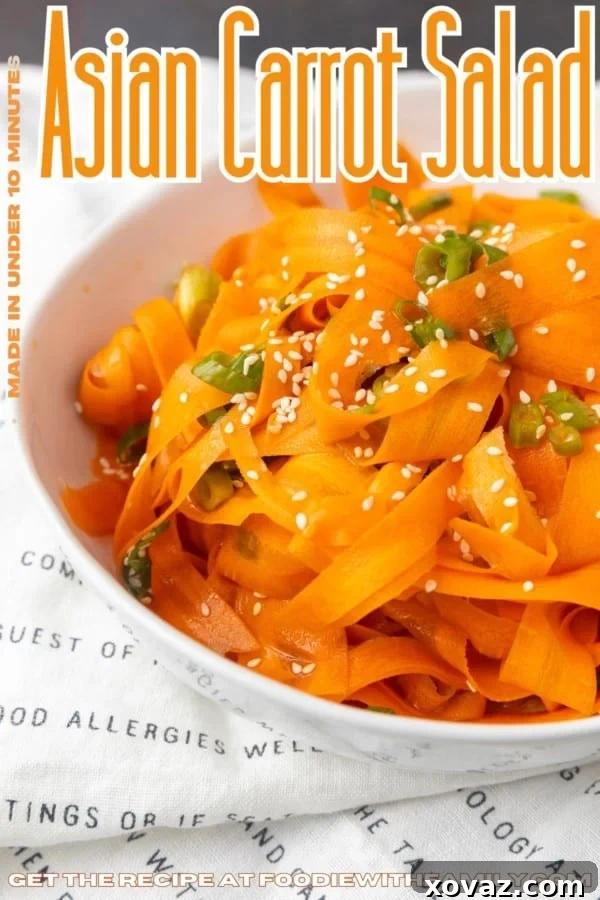Beautiful Asian Carrot Salad in a white bowl with text overlay describing the photo and recipe name