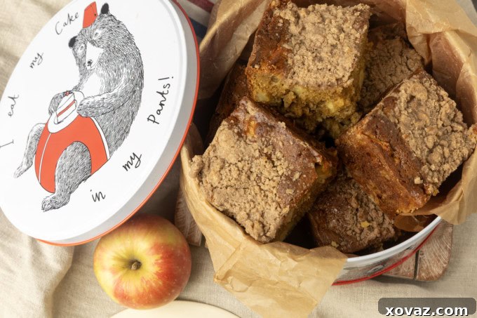 Classic Apple Streusel Coffee Cake 4 A whole Apple Coffee Cake in an 8-inch square baking pan, generously topped with brown sugar crumbs.