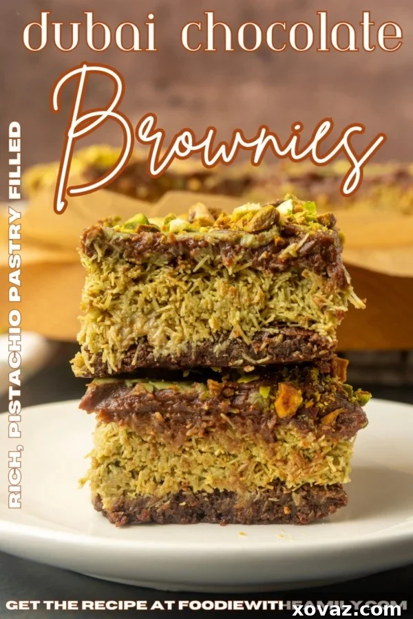 Viral Dubai Chocolate Brownies on parchment paper and stacked on a plate with text overlay describing the photo