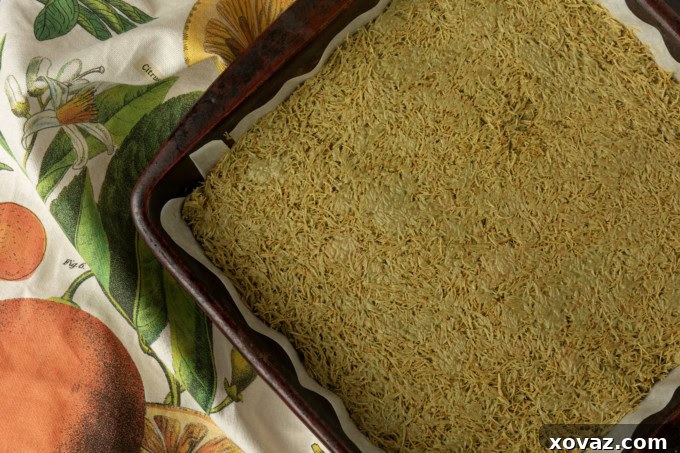 Viral Dubai Chocolate Brownies filling spread over brownies in a pan