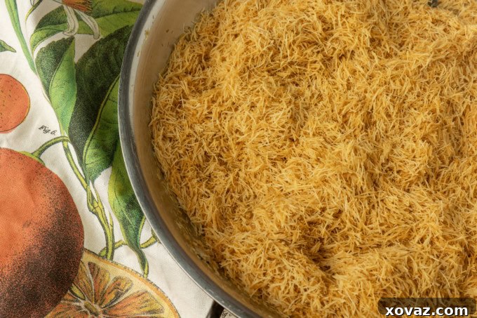 Toasted kataifi in a skillet, showcasing its golden color