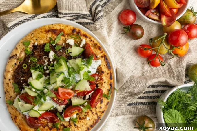 Close-up of freshly prepared tzatziki sauce with cucumber and dill.