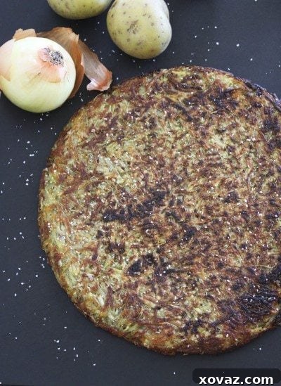Golden-brown, crispy Roesti, a Swiss potato pancake