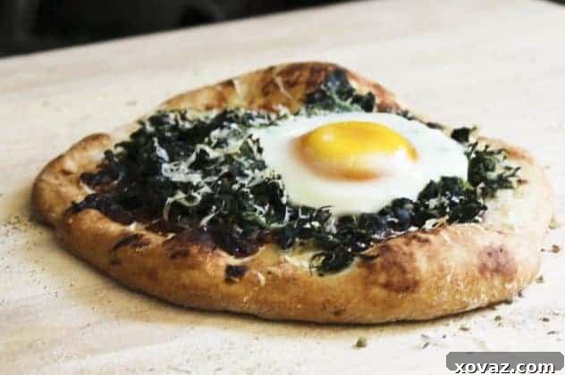 Fancy-Pants Breakfast Pizza with Egg Close-up of the partially cooked Fancy-Pants Breakfast Pizza with an egg