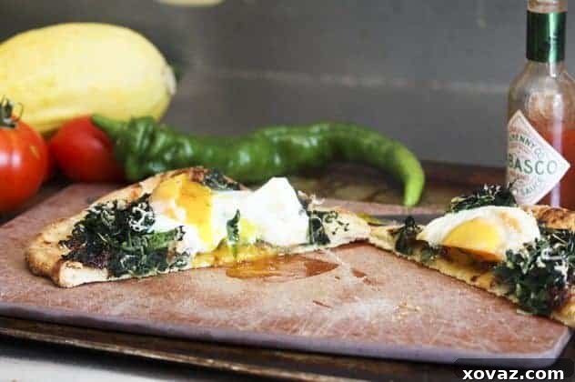 Finished Fancy-Pants Breakfast Pizza Finished Fancy-Pants Breakfast Pizza, cut in half, with a runny egg yolk