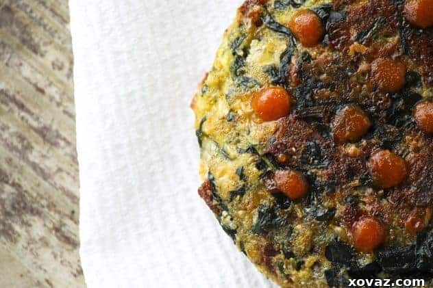 Spinach Bacon Cheddar Bites with sriracha Spinach Bacon Cheddar Munchy Cakes with neatly placed sriracha dots