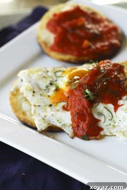 Rich red pepper spread in a jar, symbolizing preserved summer flavor.