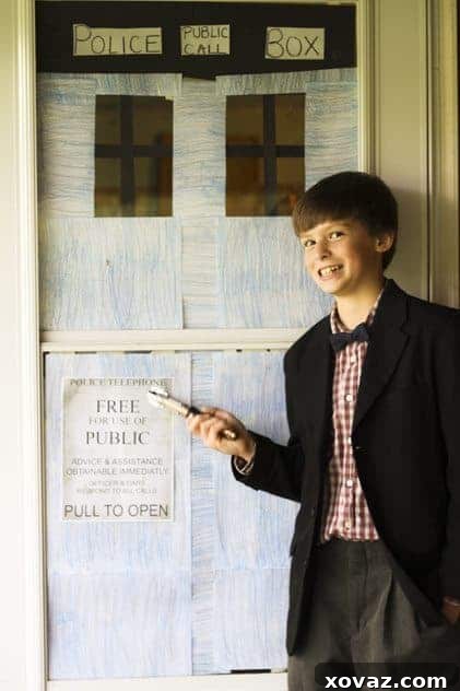 A young boy dressed as the Doctor, with a bow tie and sonic screwdriver