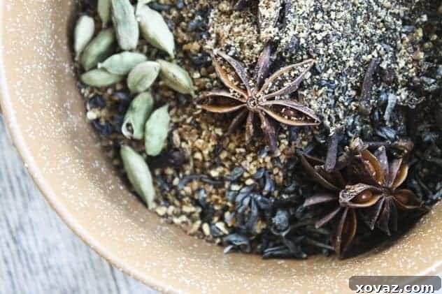 A cozy scene with spiced orange chai concentrate and autumnal elements