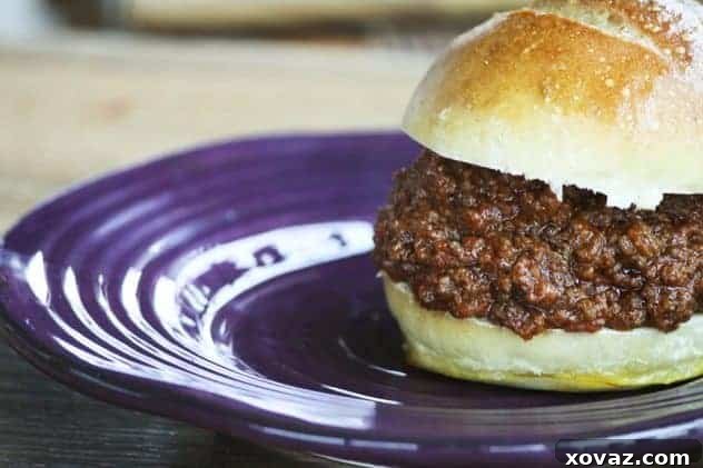Delicious slow cooker sloppy joes piled high on a bun, ready to serve