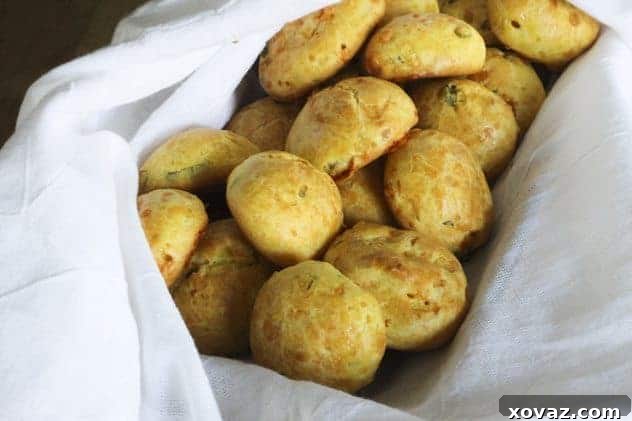 A second image of baked Dijon Cheddar Scallion Puffs, showing their airy texture and golden color.