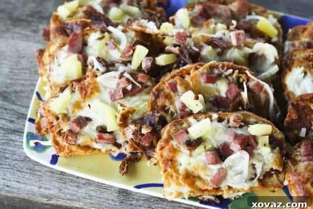 Close-up of a homemade English Muffin Bread Pizza with cheese and toppings.