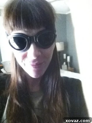 Author wearing goggles and a t-shirt, smiling.