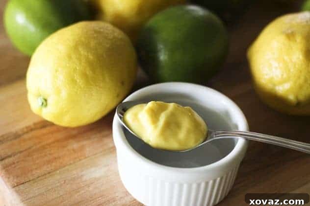 A vibrant bowl of homemade lemon-lime curd, ready for use in desserts.