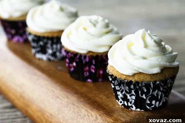 Earl Grey Cupcakes with Lemon Buttercream, beautifully presented on a serving dish.
