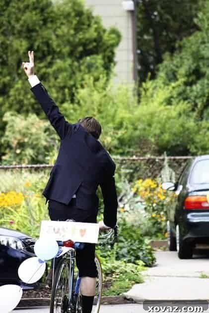 Luke, the groom, making a triumphant hand gesture after his wedding.