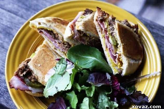 Deliciously pressed Cuban sandwich with melted cheese and fillings